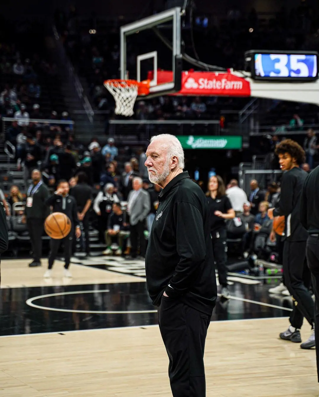 Popovich standing in the court at Moody Center ATX, April 2023
